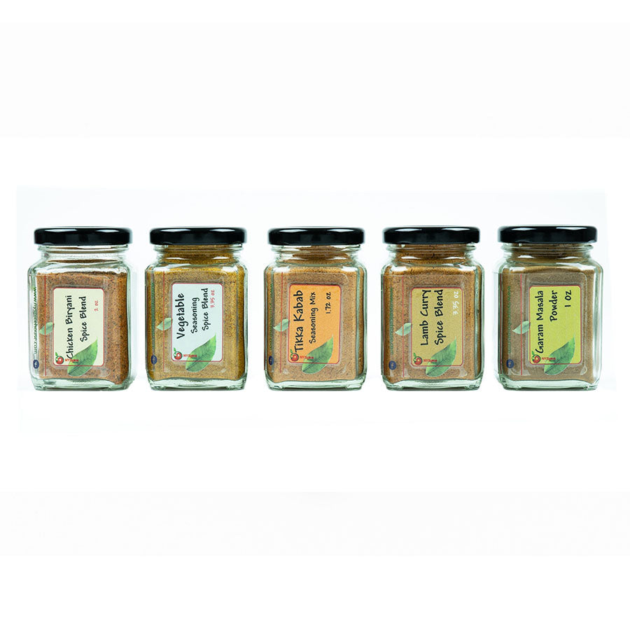 A set of small spice jars full with various colorful Indian